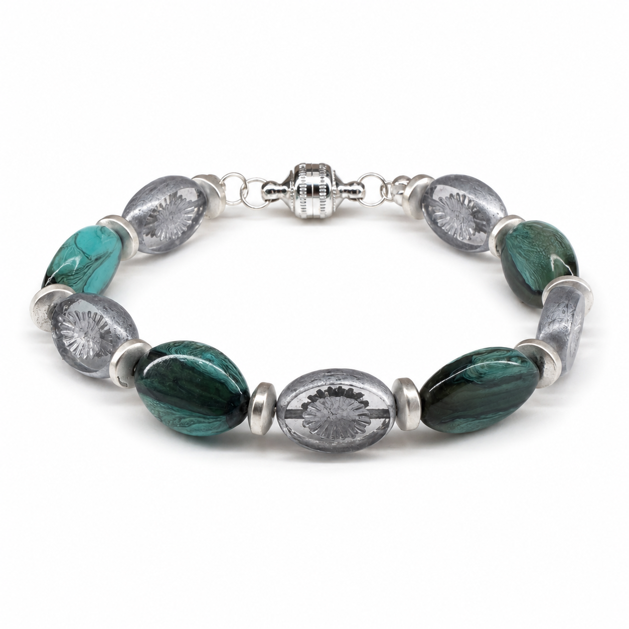 Handcrafted bracelet featuring marbled teal glass beads, translucent etched glass beads, sterling silver accents, and a decorative magnetic clasp.